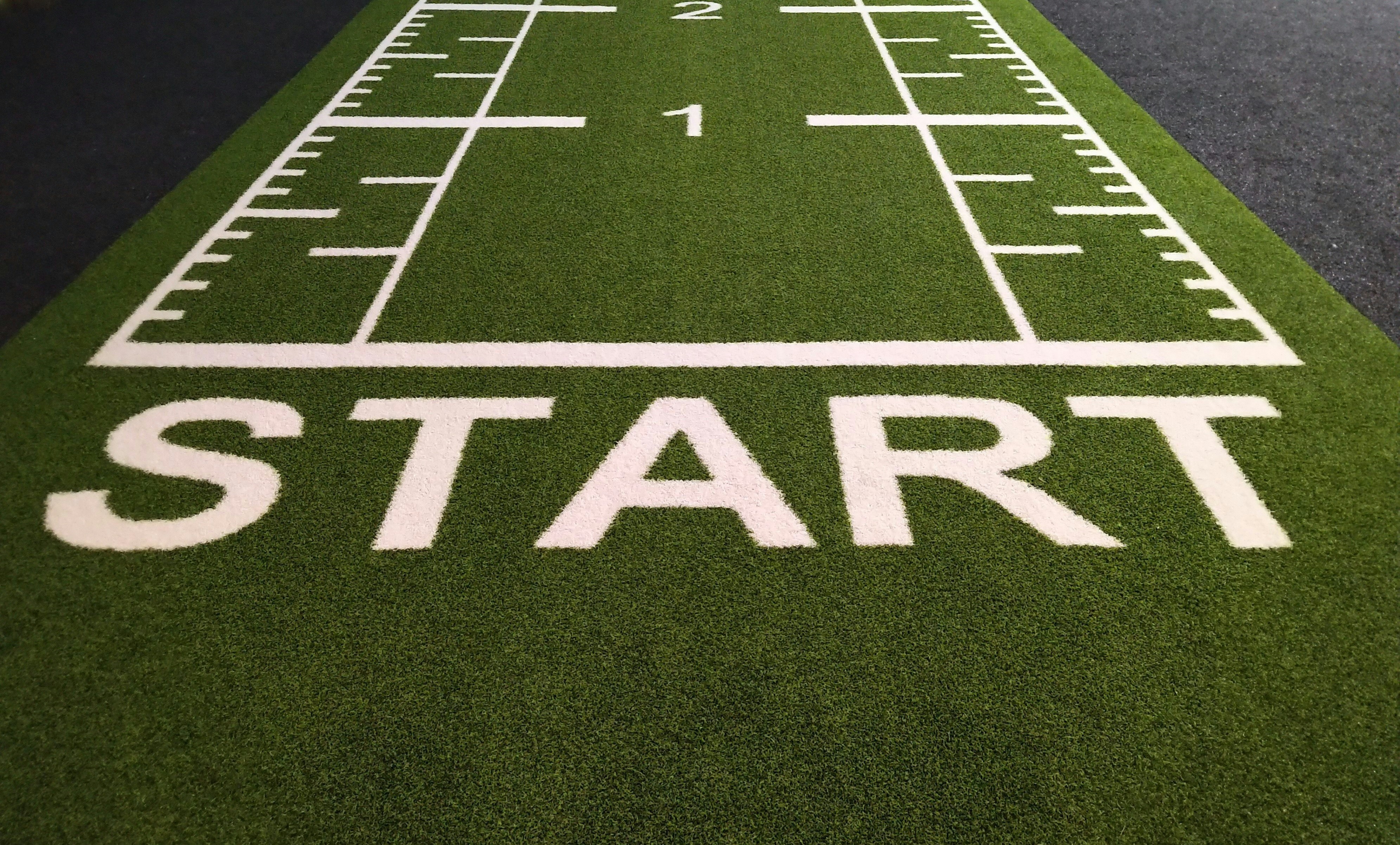 Start line on artificial turf — representing the beginning of the mortgage process